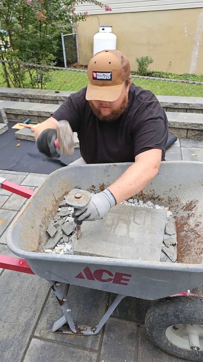 MikesGreenGrass owner working on a patio